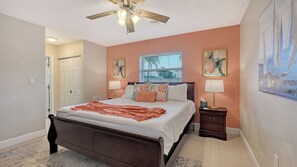 Primary bedroom with king size bed and en suite bath