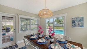 Bright and airy dining area that seats 8 for dinner or family game night