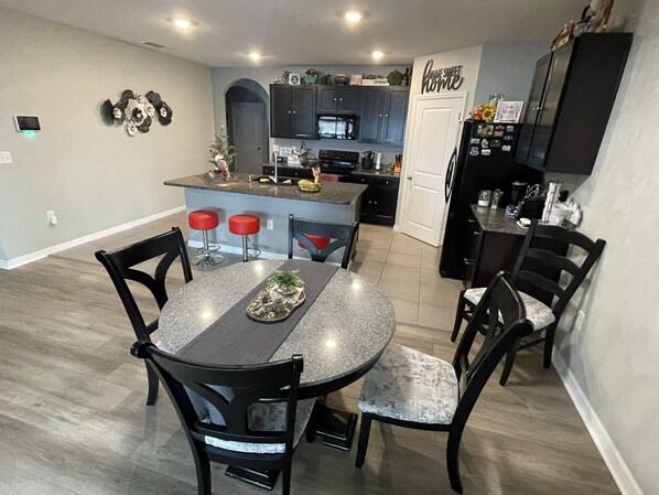 Dining area looking into the kitchen and main hallway