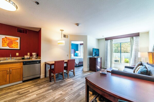 This is the living room, interior corridor true 1bd, the exterior entry look a bit different. Some have carpet, most have hard flooring. Furniture varies.