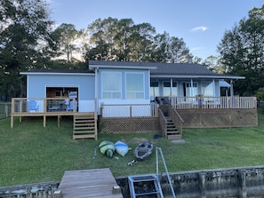 Back deck and game room with garage doors open