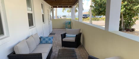 Private outdoor living room, & two-top dining table for beach adjacent relaxing!