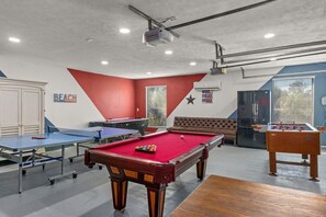 AMAZING game room, featuring: foosball, pool table, ping pong, air hockey, smart TV, & fridge