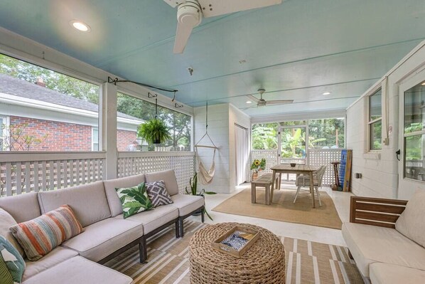 The screened-in porch allows for year-round hanging out or dining.