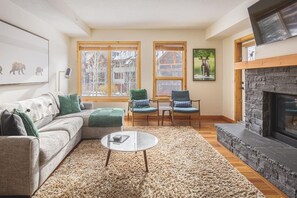 Gorgeous living room with sofa bed sectional (memory foam mattress), and that incredible rundle rock fireplace.