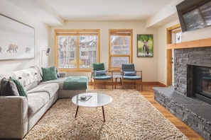Gorgeous living room with sofa bed sectional (memory foam mattress), and that incredible rundle rock fireplace.