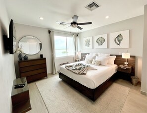 Master bedroom with a king bed and unobstructed views of the Cayes!!