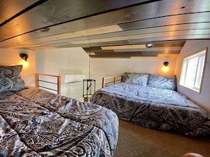 Full and twin mattresses in the sleeping loft