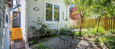 Historic Victorian era cottage nestled under hawthorne and cherry trees

