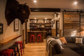 Bonus room with a convenient kitchenette and an abundance of cozy seating options.