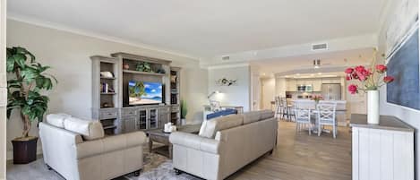 Updated and spacious living room with coastal furnishings