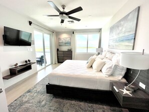 Master Bedroom with King Bed, 42" Smart TV, USB outlets and safe in closet.