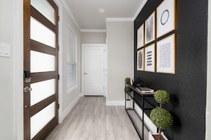 The entrance features tasteful and gold accented decor!
