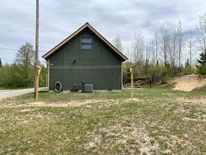 Side view showing clothesline and hose available for use.