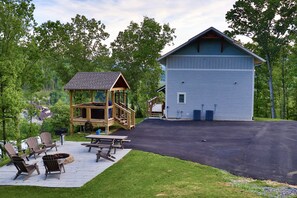 Great outdoor space with hot tub, fire pit, grilling area, and plenty of parking