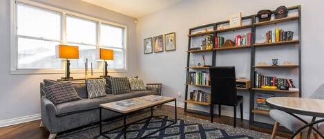 Living room with desk/library - perfect for entertaining or sitting back and enjoying a great read