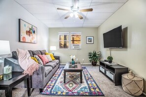 a cozy living room with a TV for your relaxation