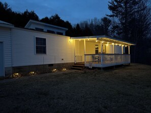 New patio lights on the covered front porch to enjoy a well lit dinner outside. 