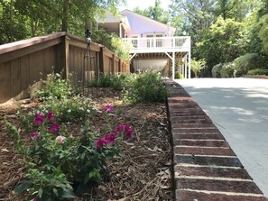 Welcoming you with our flower garden along the driveway.