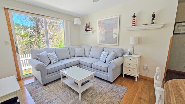 Living room with comfortable sectional and flat screen TV