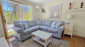 Living room with comfortable sectional and flat screen TV