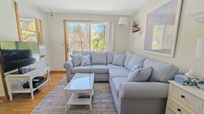 Living room with comfortable sectional and flat screen TV