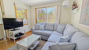 Living room with comfortable sectional and flat screen TV