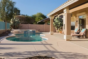 Backyard w/ swimming pool and spa heating optional, fee required, overlooking golf course