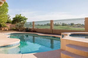 Backyard w/ swimming pool and spa heating optional, fee required,  overlooking golf course