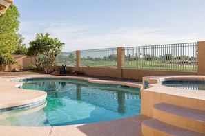 Backyard w/ swimming pool and spa heating optional, fee required,  overlooking golf course