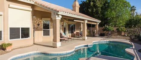 Backyard w/ swimming pool and spa heating optional, fee required overlooking golf course