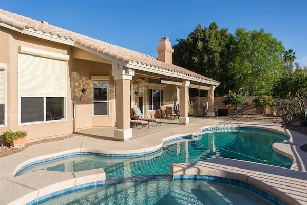 Backyard w/ swimming pool and spa heating optional, fee required overlooking golf course