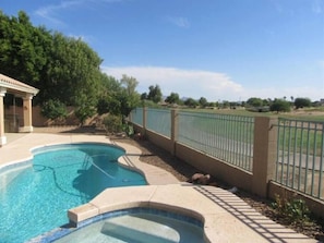 Backyard w/ swimming pool and spa heating optional, fee required, overlooking golf course