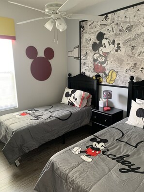 Mickey Mouse Bedroom with two twin beds and luxury vinyl flooring