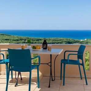 Balcony Dining with a View
Alfresco dining overlooking the coastline and greenery