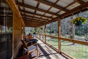 Front porch views with fireplace, outdoor seating and grill 