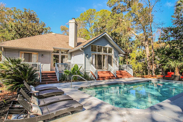 Lounge poolside and enjoy the backyard oasis