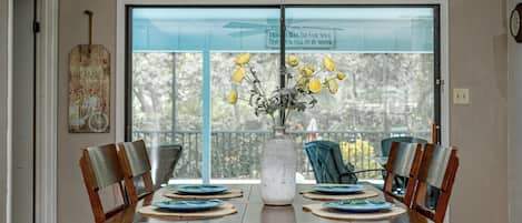 Dining table with ext. leaf. (Located in master closet). Extra chairs in garage.