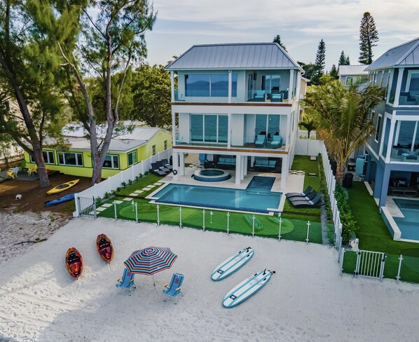 Welcome to Beachfront Bliss with stunning sunrises, incredible sunsets and the coziest home loaded with amenities! Kayaks, Paddle Boards, etc. tranquility, and unforgettable memories await.