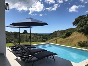 Pool side and ocean view of the Caribbean Sea,overlooking 200 acre horse ranch