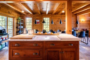 Open kitchen with a lot of counter space - 3 stools provide extra island seats.