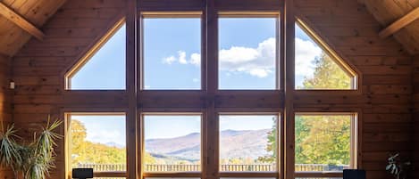 Oversized windows in the living room frame the views of the Hunter ski slopes.