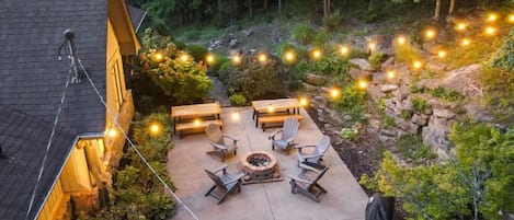 Beautiful back patio with fire-pit, grill and tons of seating for socializing