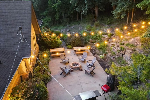 Beautiful back patio with fire-pit, grill and tons of seating for socializing