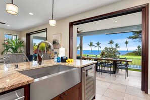 Kitchen with a seamless transition to an oceanfront patio, perfect for entertaining.