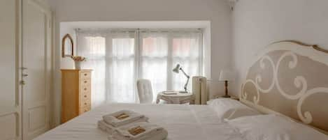 The Bedroom - The comfortable double bed with soft bed-linen and towels