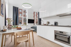 Our apartments contains a spacious dining compartment and a fully equipped kitchen