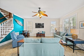 Gather the family for a movie night! The living room offers a 55" Smart TV.