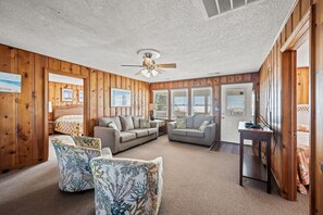 This comfy living room offers space for everyone to gather!