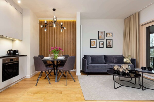 Relax in the stylish living room with a comfortable sofa and modern decor.